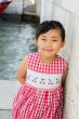画像1: 【JiJiオリジナル】 チェリー刺繍のスモッキングラップワンピース (レッドチェック) 2歳-8歳 (1)